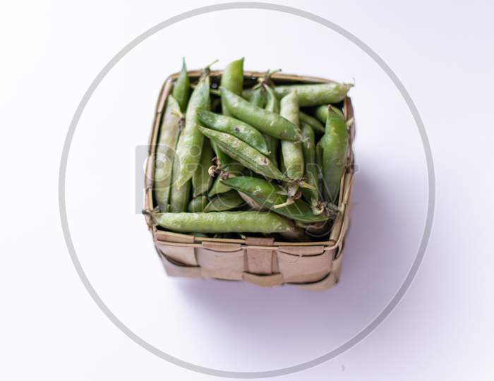 Healthy fresh green peas top view flat lay with white background.