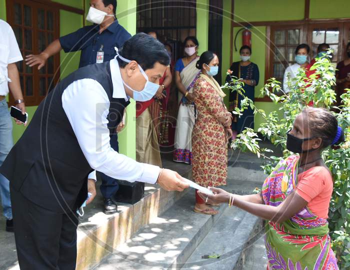 Assam Chief Minister Sarbananda Sonowal Distributing Masks To Staff And Inmates Of State Home For Women At Jalukbari In Guwahati On April 26,2020