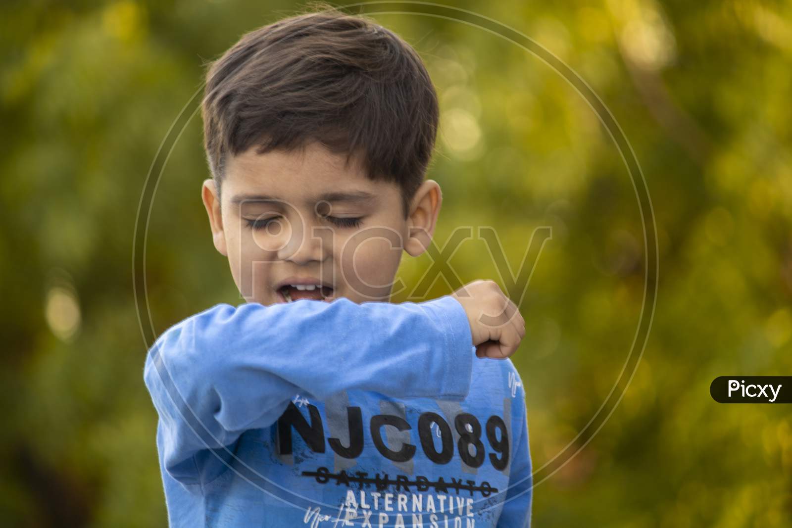 Indian Child Coughing On His Elbow Showing Tips To Protecting Corona Virus