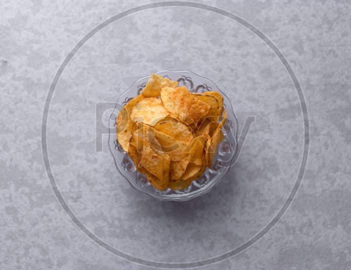 Potato Chips  In a Bowl On an Isolated Grey Background