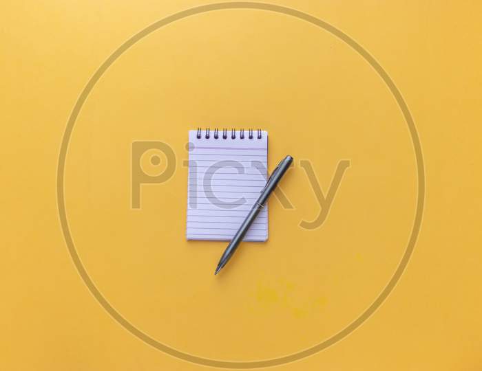 Flat Lay With Notes and Pen On an Isolated Background