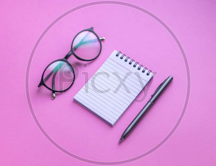 Flat Lay With Notes, Pen an Spectacles On an Isolated Background
