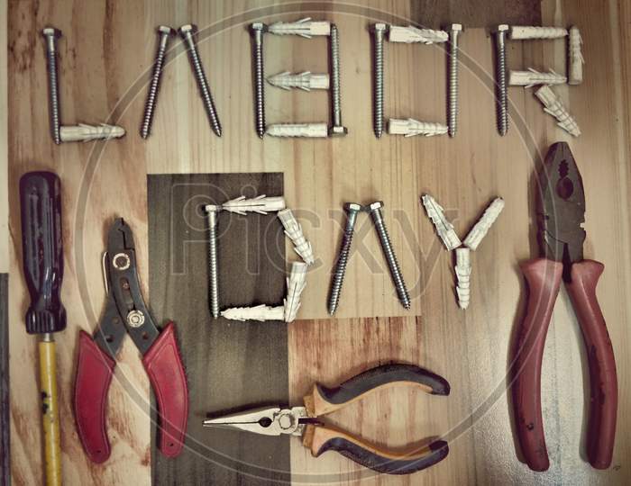 labor day with joinery tools on wooden background texture, workers day, May day