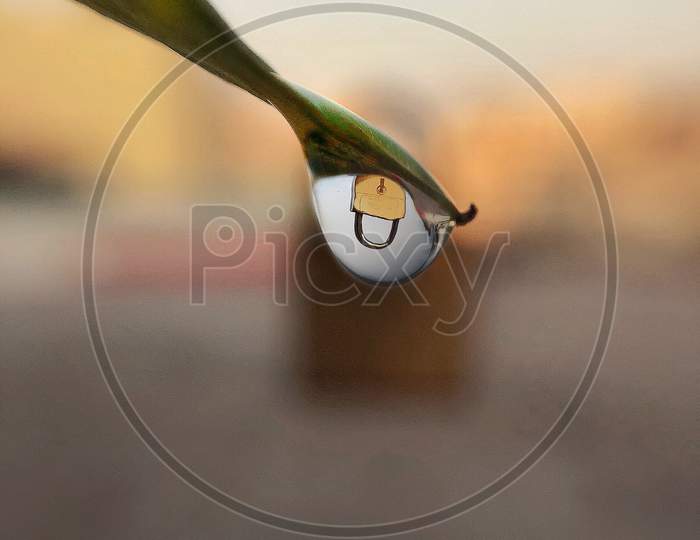 Reflection of lock through the droplet explains the current situation in the country