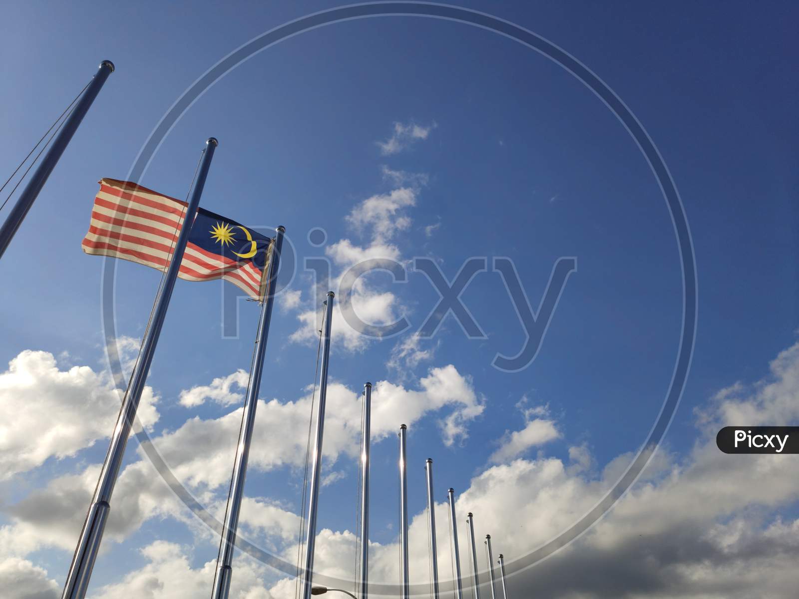 March 15, 2020 - Sabah, Malaysia : Flag of Malaysia flown on flagpole with sky background