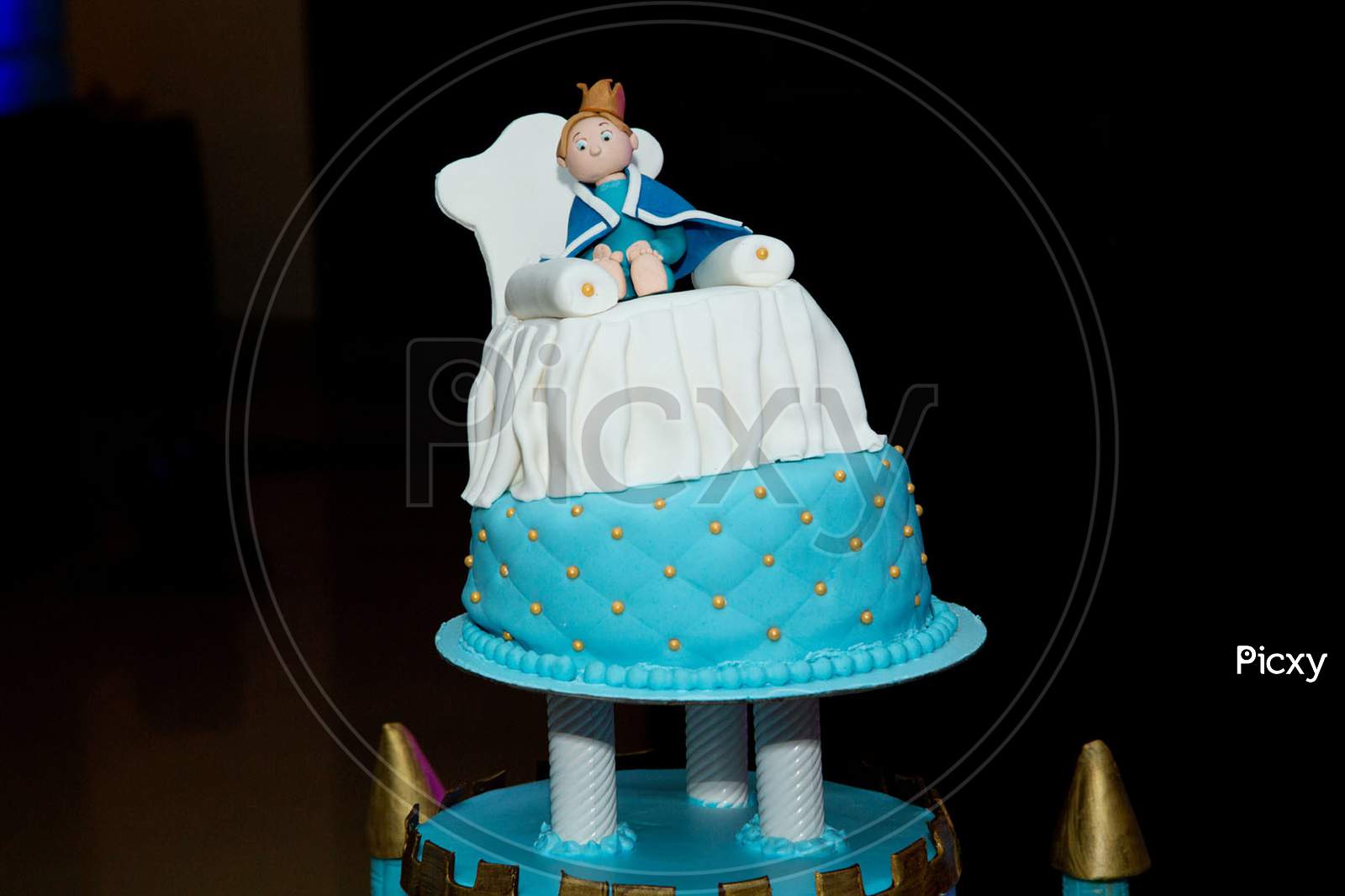 blue castle birthday cake with doll for kids party