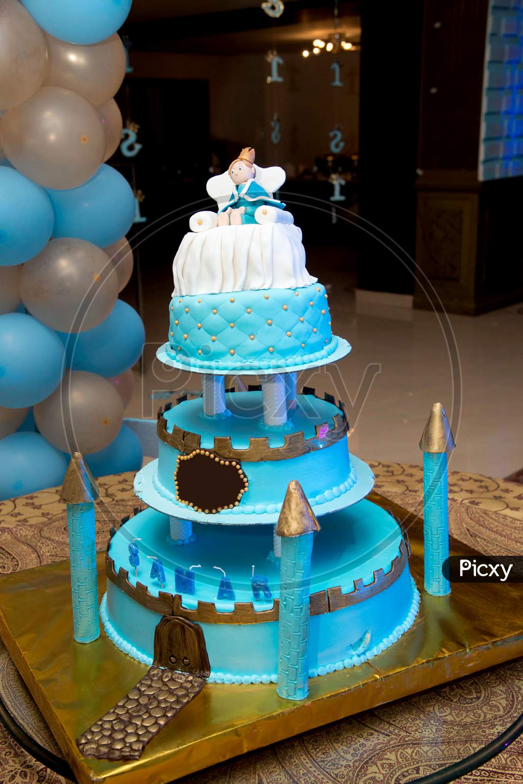 Image of blue castle birthday cake with doll for kids party ...