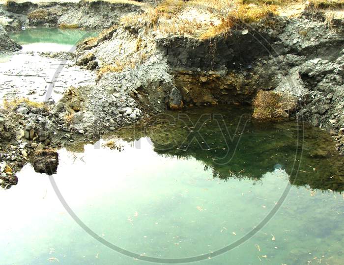 Water Inside The Big Hole Of An Agricultural Land Of Nepal, Naturally Created, Tourist Attraction