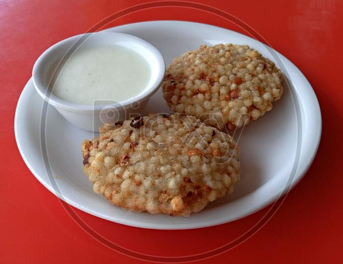 Sabudana vada with curds tasty indian snack, also known as Tapioca pearls.