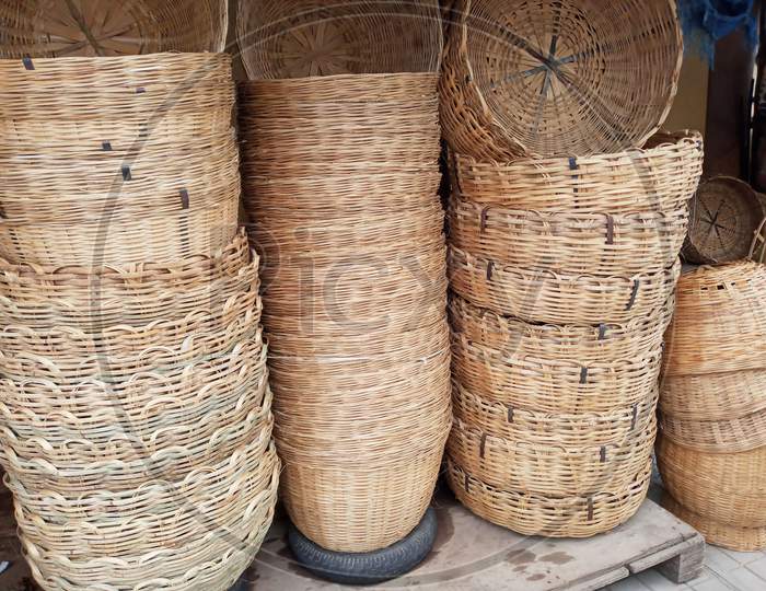 Cane baskets hand woven stacked in a road side market in Bengaluru/India.