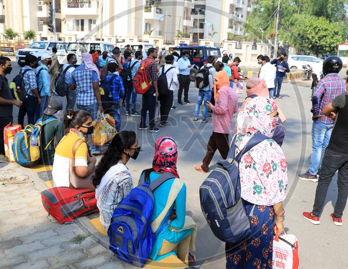 students who had been stranded in the city for more than a month due to lockdown imposed to prevent the spread of Coronavirus board a specially scheduled bus to their respective hometowns, in Prayagraj on April 29, 2020.