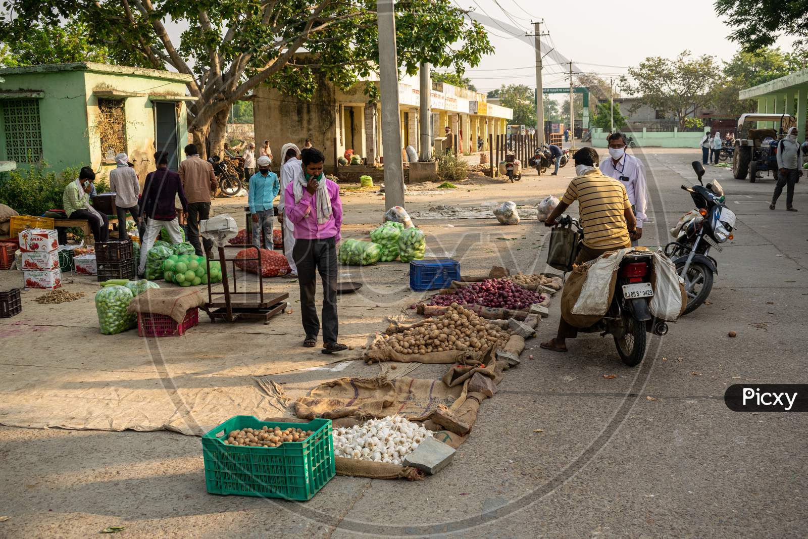 Vegetable sellers selling vegetables at Sabzi Mandi or vegetable market after partial exemption from lockdown due to Coronavirus or Covid1-19
