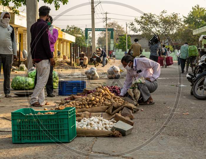 Vegetable sellers selling vegetables at Sabzi Mandi or vegetable market after partial exemption from lockdown due to Coronavirus or Covid1-19