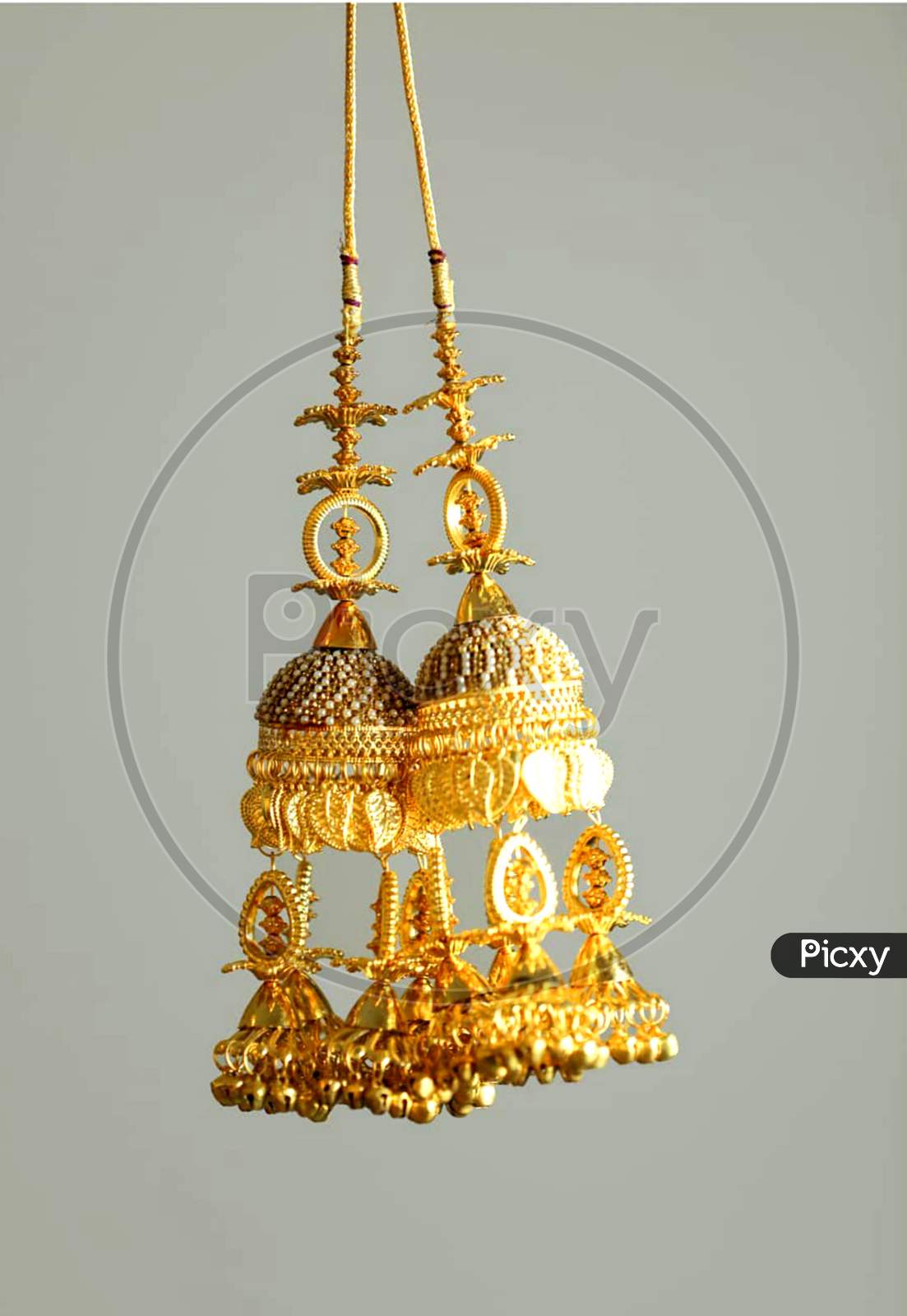 Beautiful earrings of golden colour used on occasional dresses