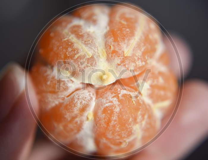 Peeled Mandarin In The Hand, Closer Look At The Structure. Selective Focus.