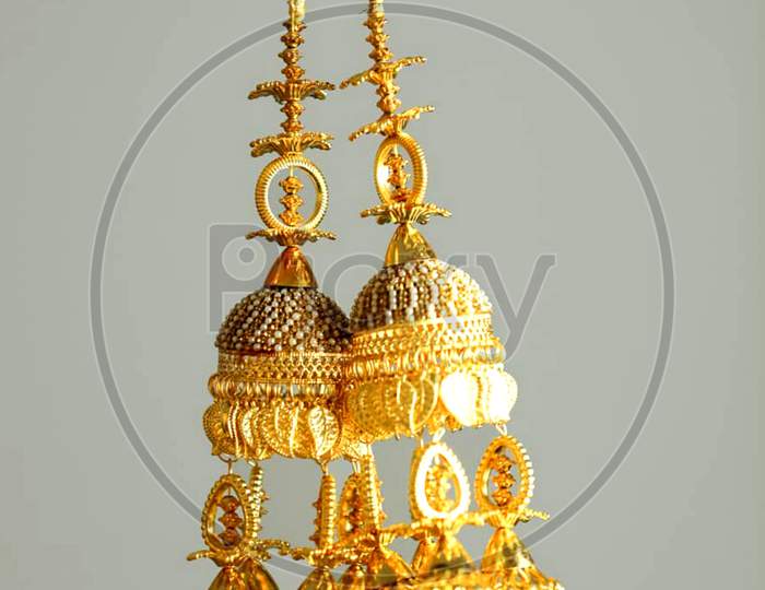 Beautiful earrings of golden colour used on occasional dresses