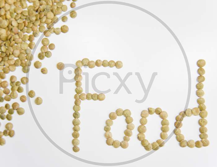 The Word Food Assembled With Grains Of Lentil On The White Background. Selective Focus. Healthy Eating Concept.