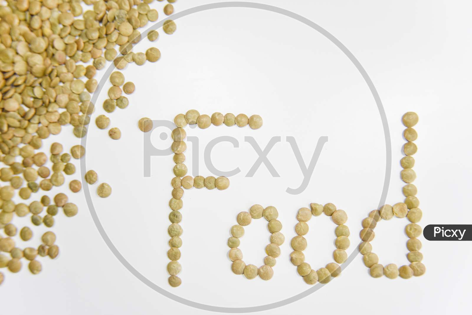 The Word Food Assembled With Grains Of Lentil On The White Background. Selective Focus. Healthy Eating Concept.