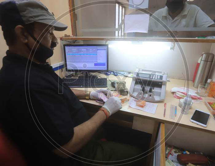 A bank employee working inside a bank during a 21-day nationwide lockdown to limit the spreading of coronavirus disease (COVID-19), Prayagraj, April 3, 2020.