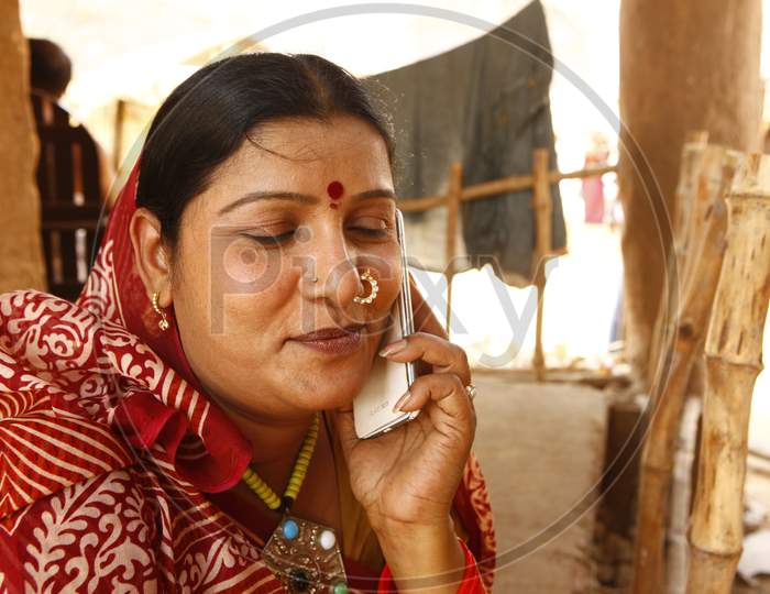 Rural Village Woman  Speaking on Mobile Phone