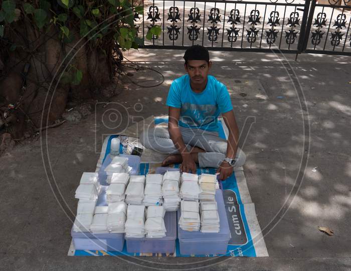 Bengaluru, Karnataka / India - September 1 2019: A roadside vendor selling mobile phone screen scratch guards