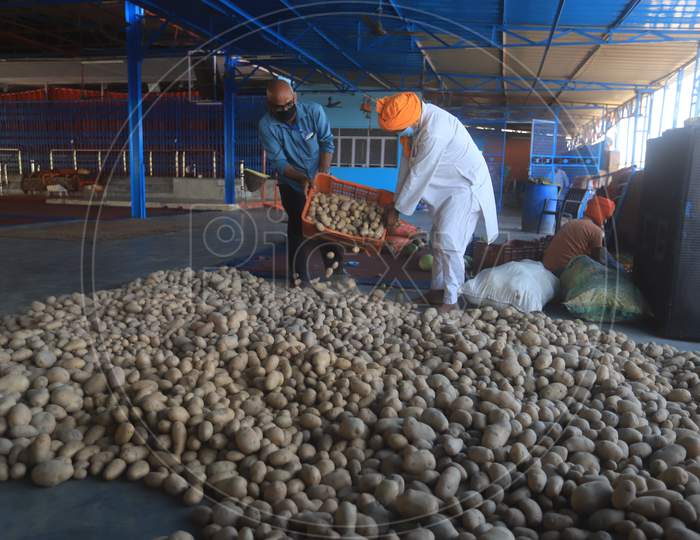 Social worker carry potatoes for food preparation of langar during a 21-day nationwide lockdown to limit the spreading of coronavirus disease (COVID-19), Prayagraj, April 3, 2020.