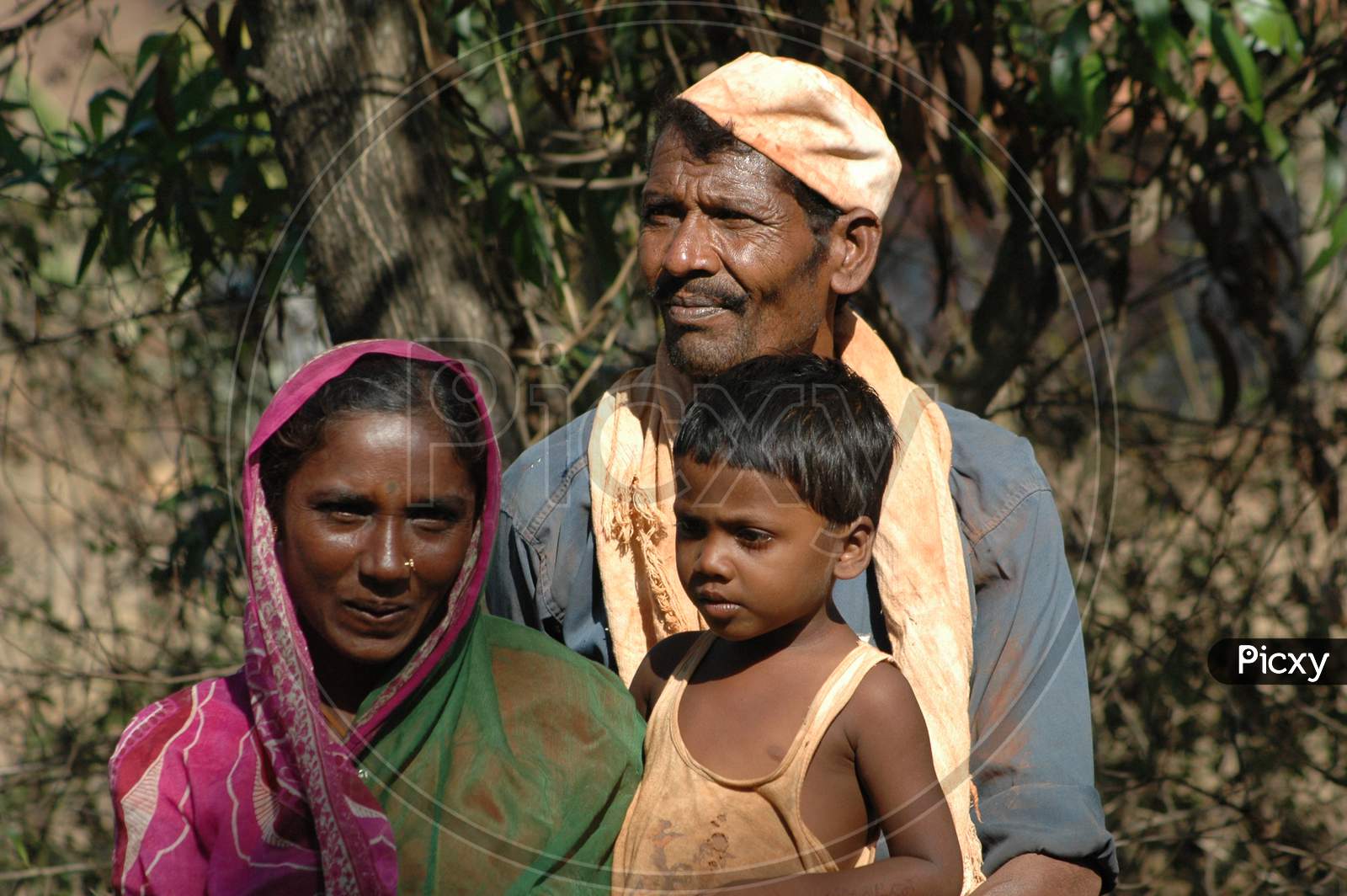 Indian Poor Family With Mother Father and a  Child