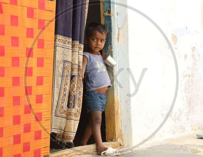 Young Poor boy At an Indian Rural Village House