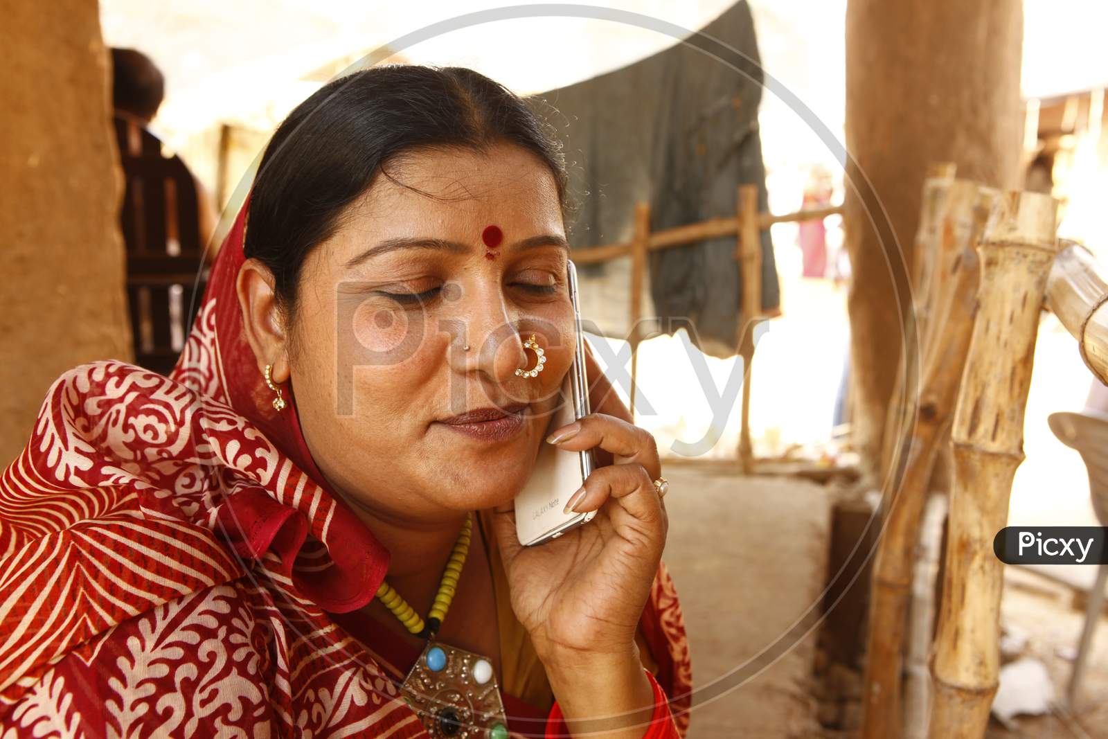 Rural Village Woman  Speaking on Mobile Phone