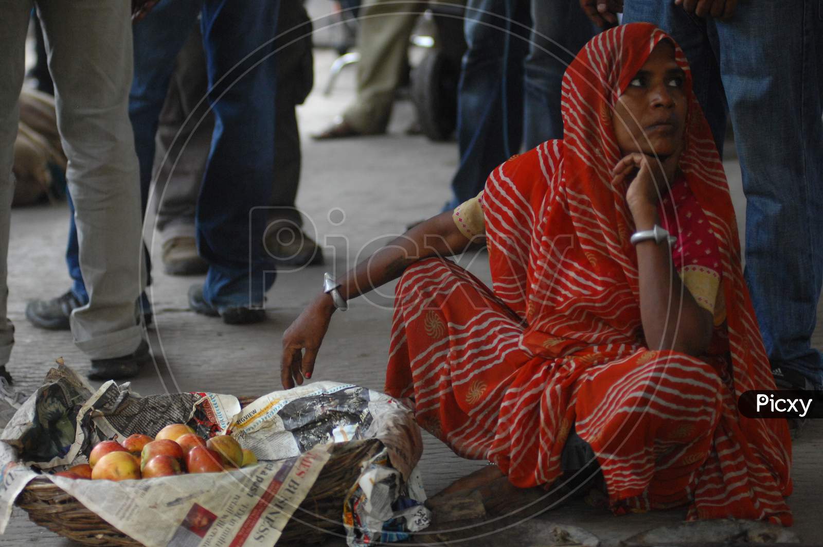 Indian Woman Vendor Selling Apples