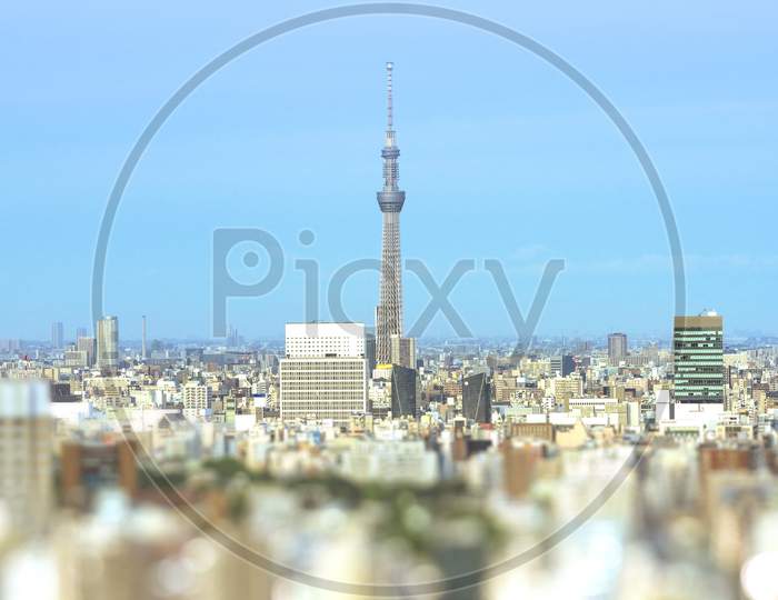 Aerial View In Tilt-Shift Of The City Of Tokyo With The Skytree Tower In The Center.