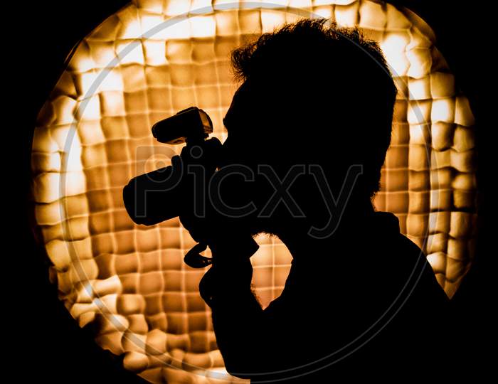Low light picture of a photographer
