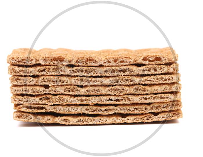 Stack Of Whole Grain Crisp Bread. Isolated On A White Background.