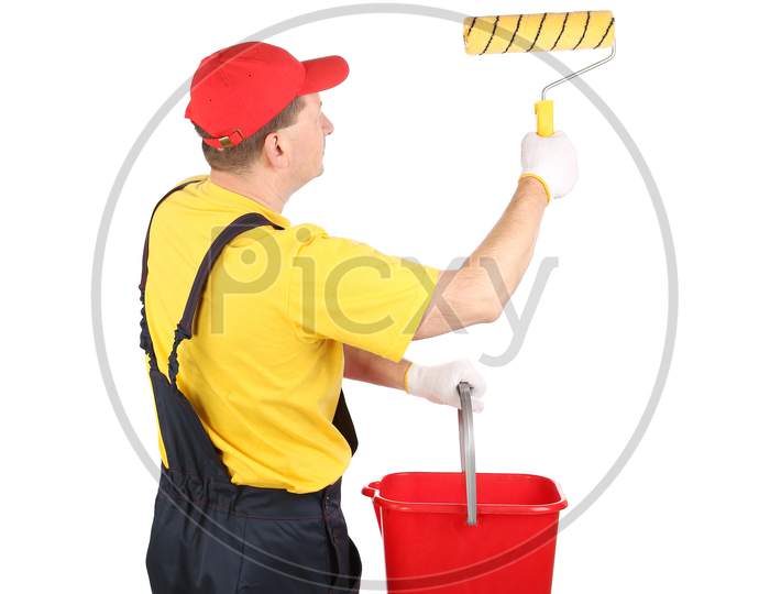 Worker In Hardhat Paints With Bucket. Isolated On A White Background.