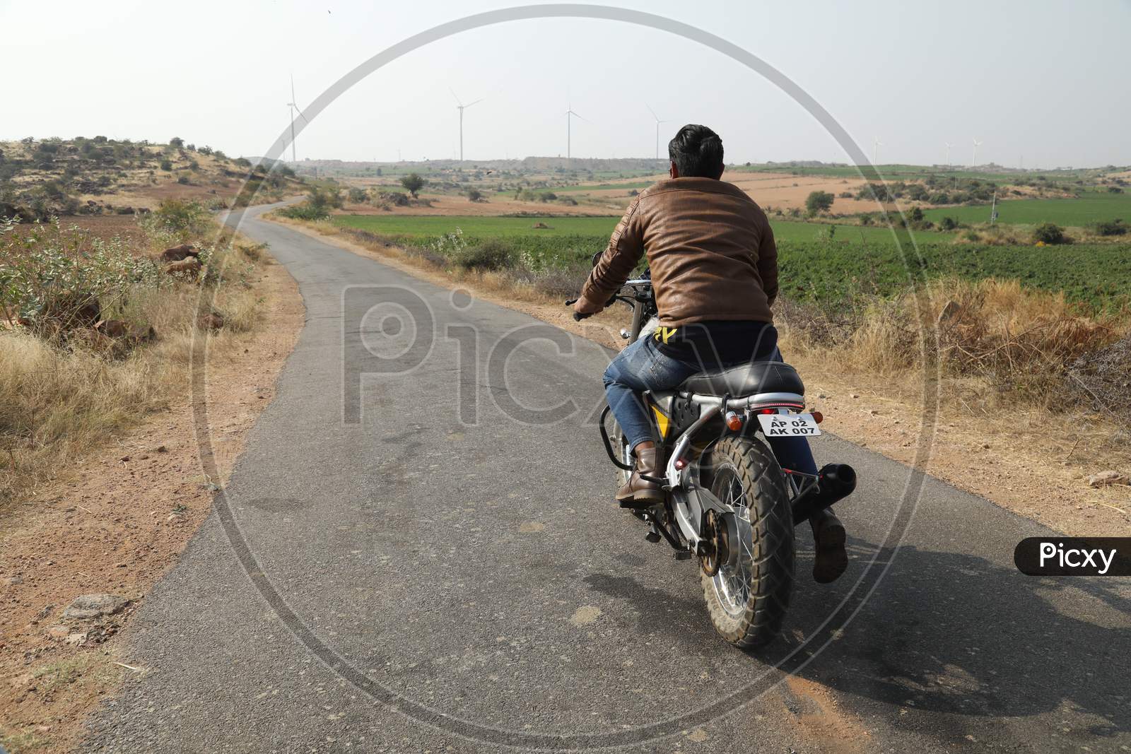 A Man Riding A Bike on Indian Rural Village Roads