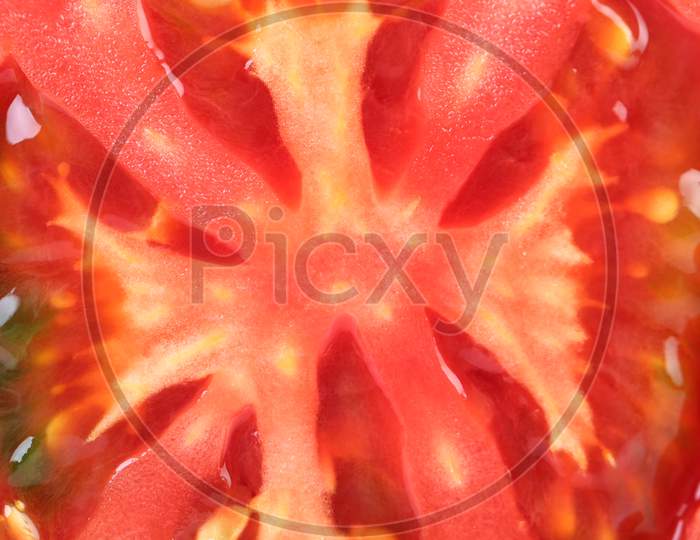 Close Up Of Tomato Slice. Whole Background.