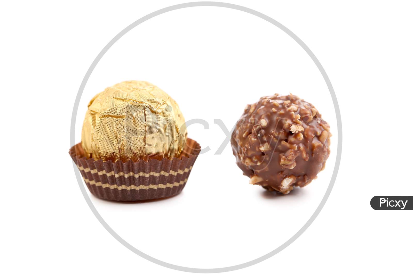 Two Chocolate Bonbons. Isolated On A White Background.