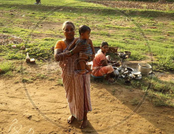 Indian Woman At Rural Village Houses With Children