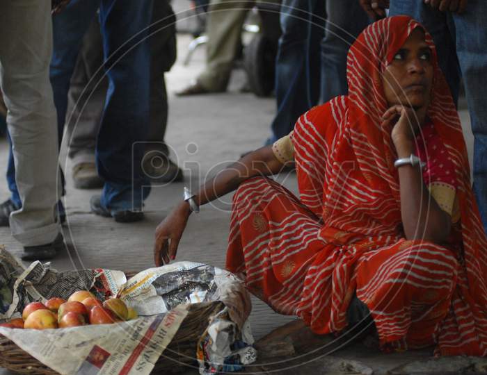 Indian Woman Vendor Selling Apples