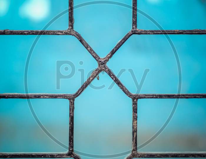 Designed Iron Rod Gate On Blue Background Picture
