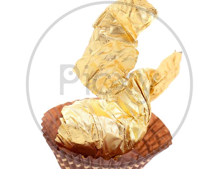 Gold Foil Of Chocolate Bonbon. Isolated On A White Background.