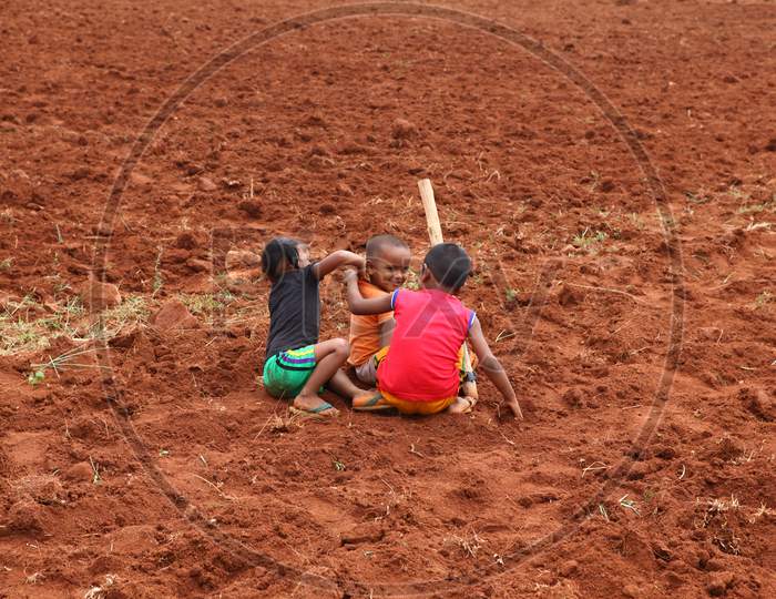 Indian Poor Children Playing in Dried Agricultural Fields
