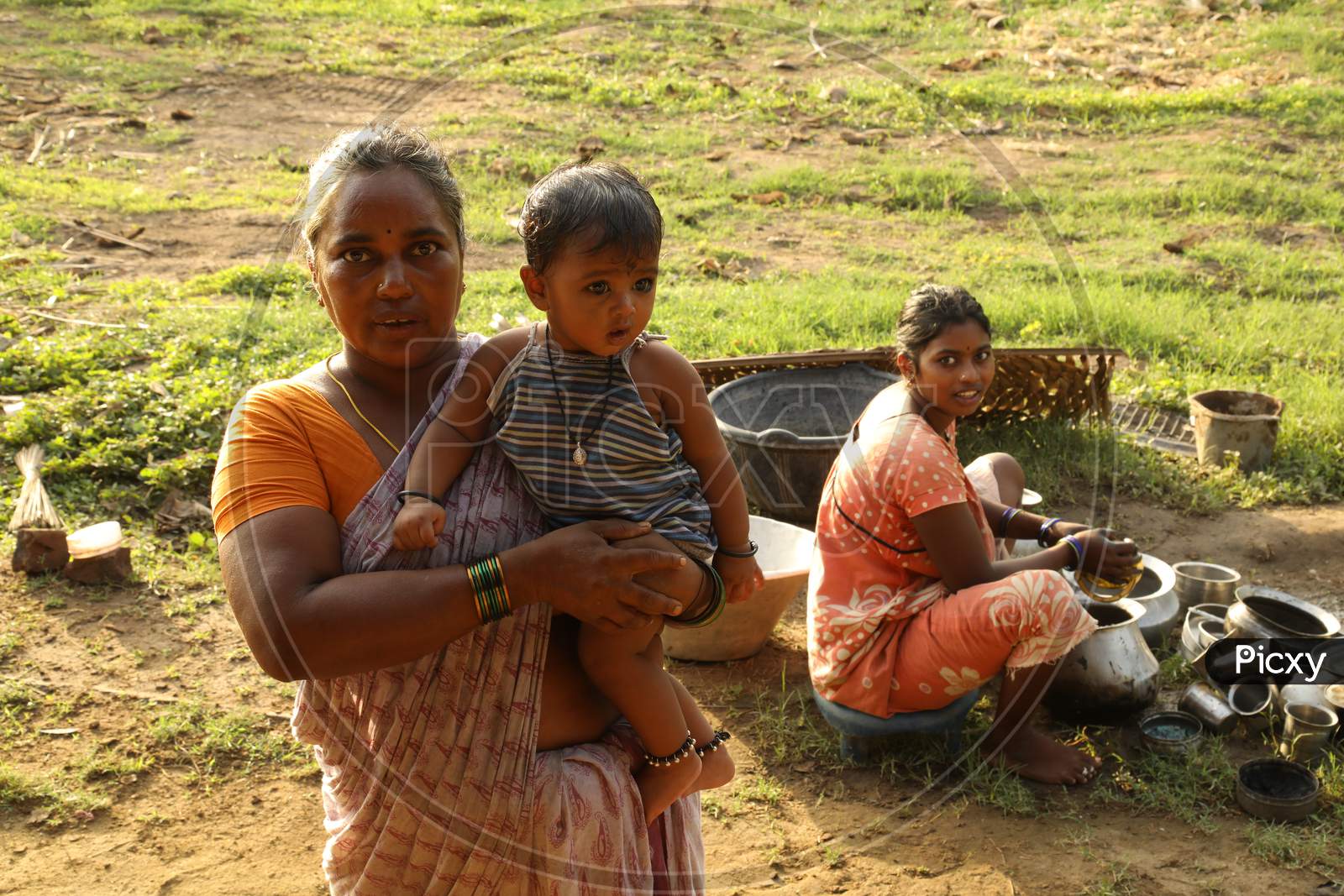 Indian Woman At Rural Village Houses With Children