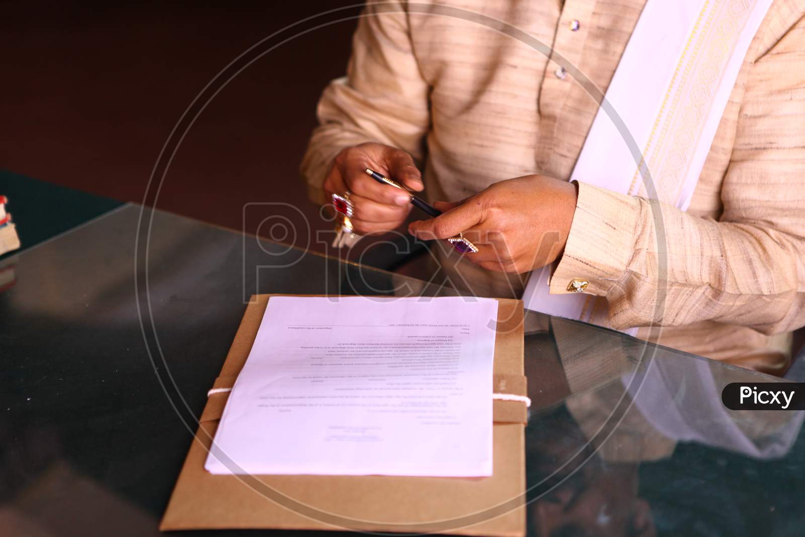 Indian Rural Village Man Writing on Paper  With a Pen