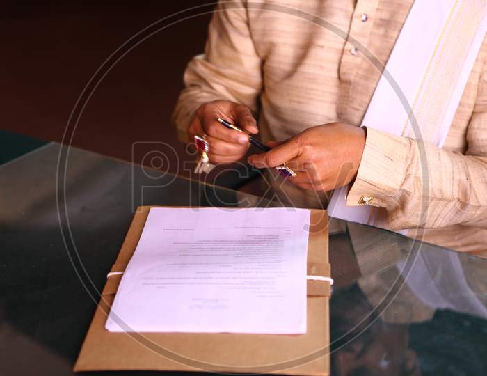 Indian Rural Village Man Writing on Paper  With a Pen
