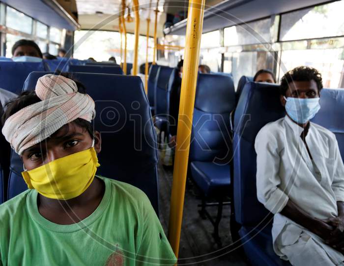 A young boy occupies a seat in a bus prior to being repatriated to his village by the government during a nationwide lockdown to prevent the spread of coronavirus (COVID-19) in Bangalore, India, April 30, 2020.