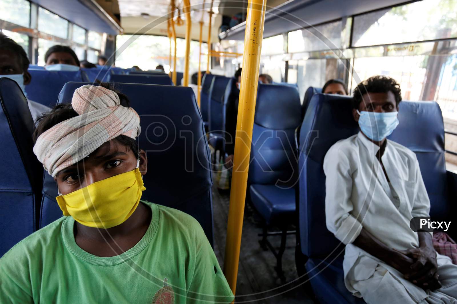 A young boy occupies a seat in a bus prior to being repatriated to his village by the government during a nationwide lockdown to prevent the spread of coronavirus (COVID-19) in Bangalore, India, April 30, 2020.