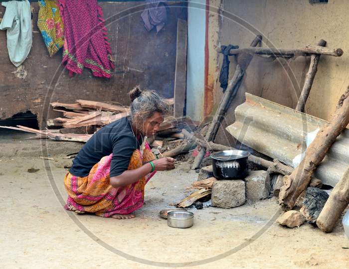 Indian Woman Making Food On Wooden Stove in a Tribal Village