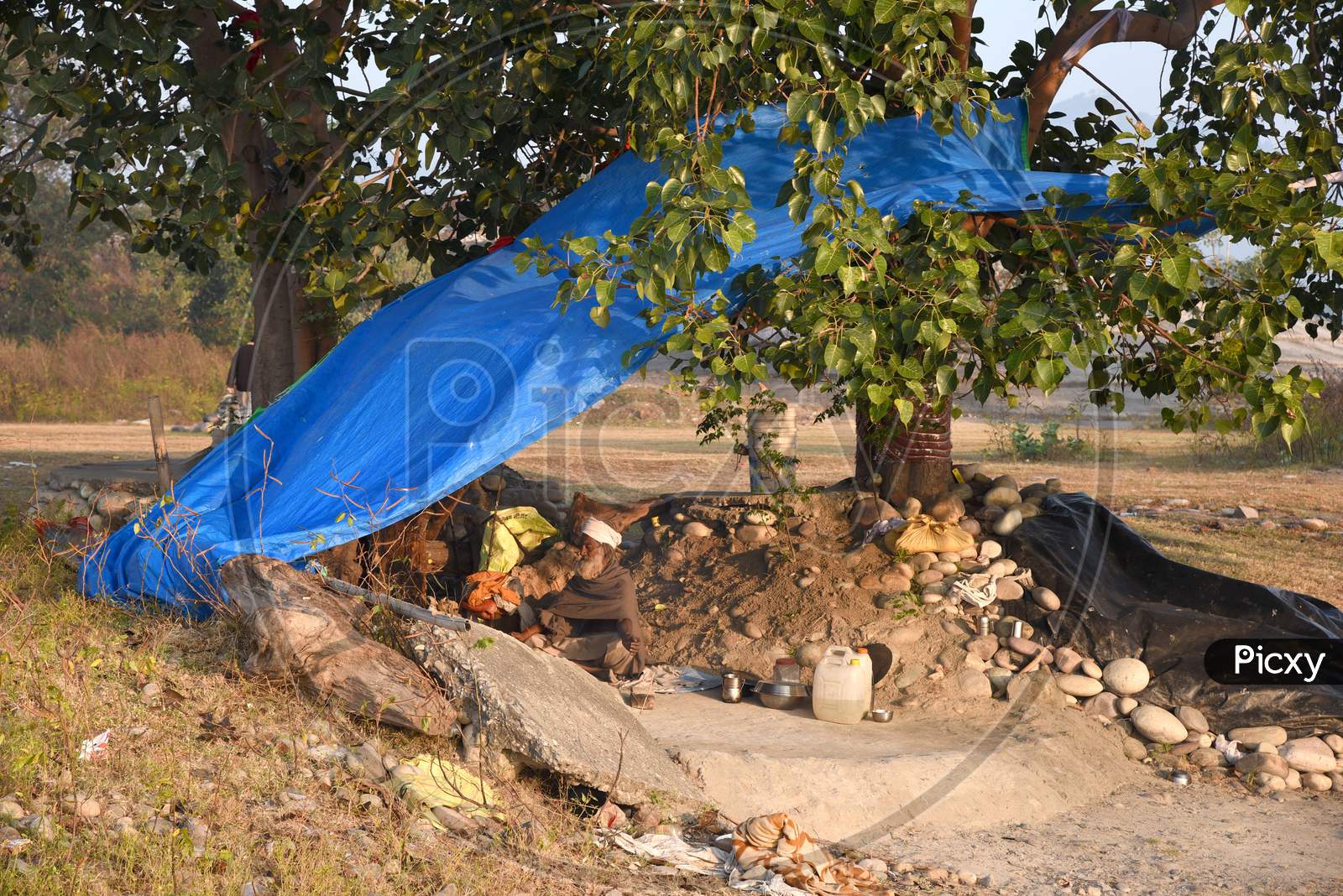 A Poor Elderly Man Living in a Road Side Tent