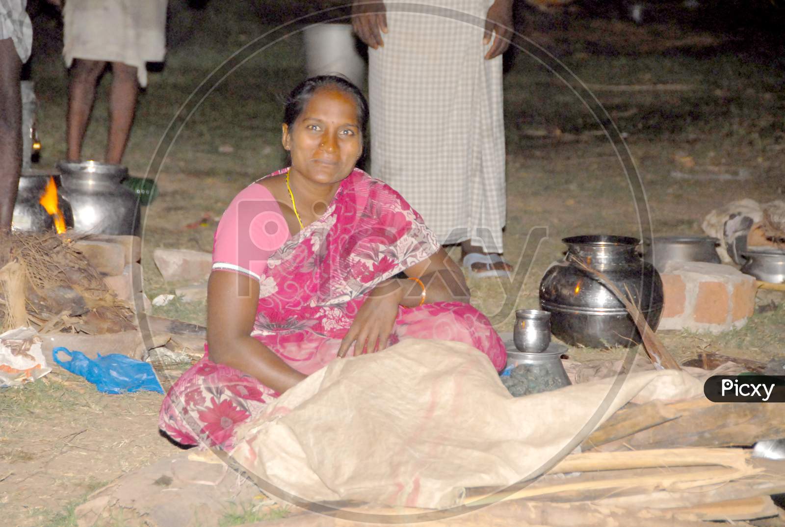 Indian Woman of a Poor Family At a Rural village Hut